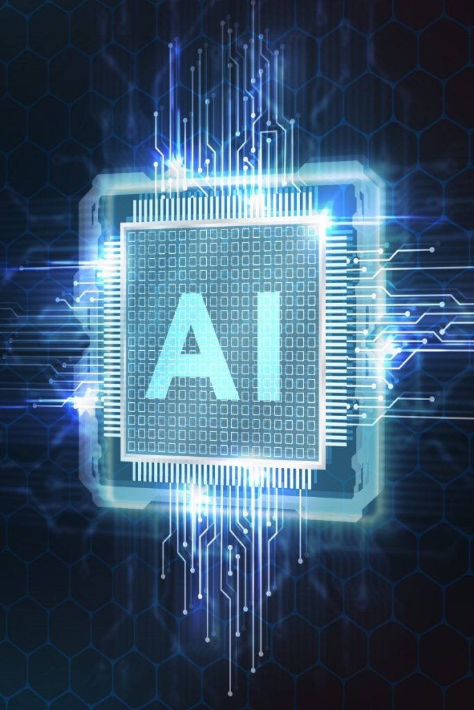 Glowing computer chip labeled AI on a circuit board