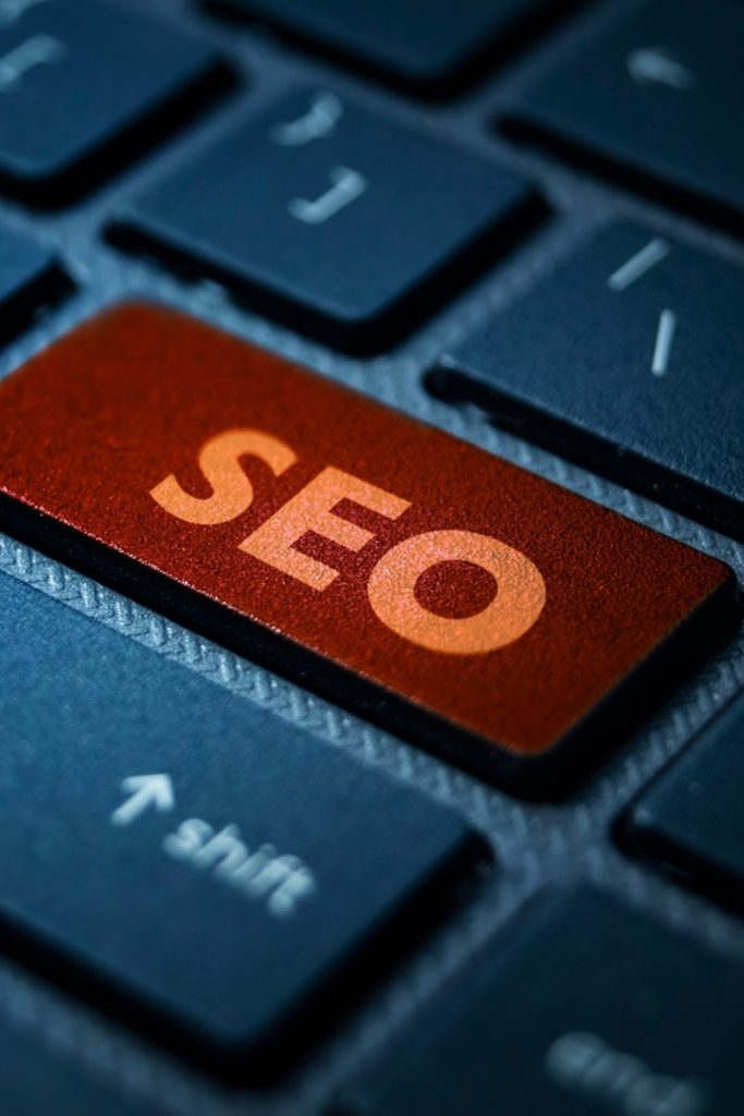 Computer keyboard with an orange key labeled SEO